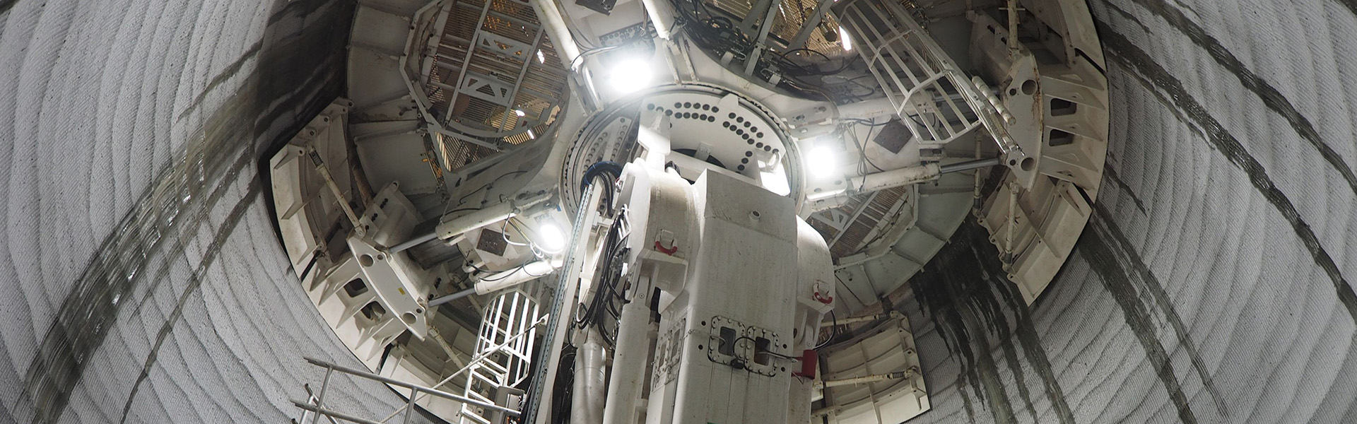 The website banner for the Shaft Sinking page shows an industrial shaft sinking machine moving up and down the mine shaft.